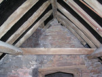 Above the doorway looking towards the church, chimney LHS Above the doorway looking towards the church, chimney LHS